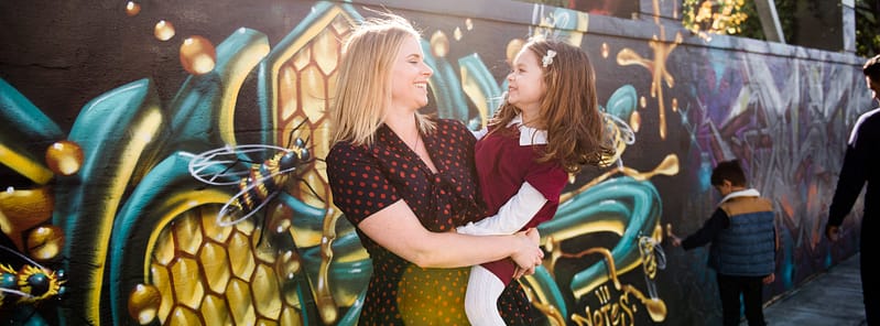 Family in front of Portland mural - Neighborhood Guide